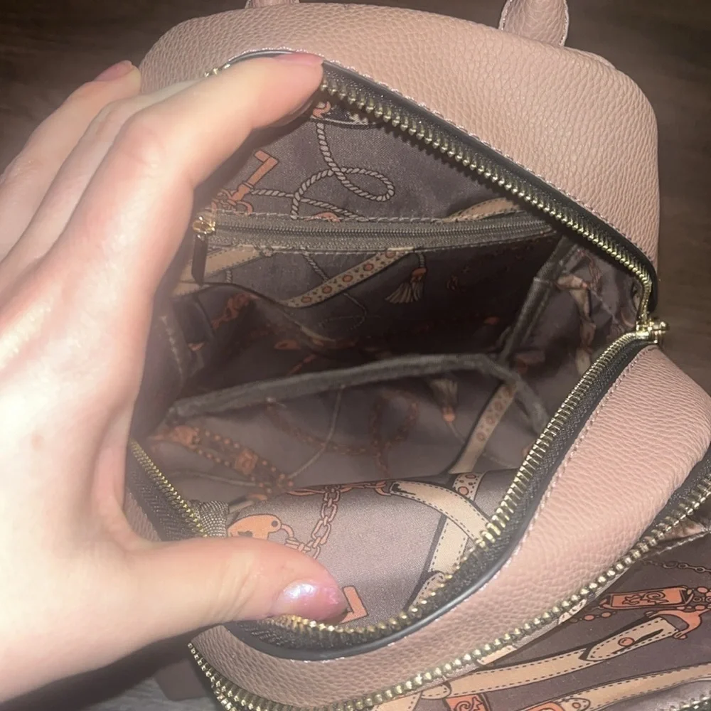 small pink faux leather backpack